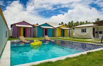 Imagem: A casa possui 4 Dormitórios, 5 Banheiros, 4 Vagas na garagem