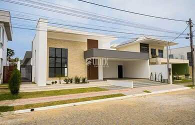 Imagem: A casa possui 3 Dormitórios, 5 Banheiros, 3 Vagas na garagem