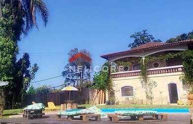 Imagem: A casa possui 3 Dormitórios, 5 Banheiros, 5 Vagas na garagem