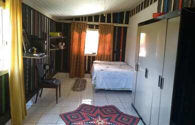 Imagem: A casa possui 4 Dormitórios, 2 Vagas na garagem e está localizado