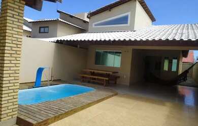 Imagem: A casa possui 3 Dormitórios, 3 Banheiros, 3 Vagas na garagem