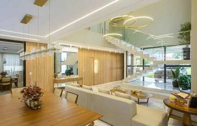 Imagem: A casa possui 4 Dormitórios, 5 Banheiros, 4 Vagas na garagem