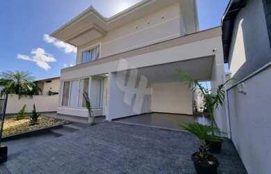 Imagem: A casa possui 3 Dormitórios, 3 Banheiros, 2 Vagas na garagem