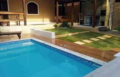 Imagem: A casa possui 3 Dormitórios, 2 Vagas na garagem e está localizado