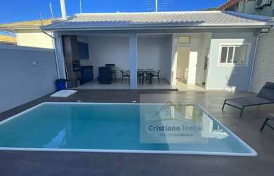 Imagem: A casa possui 4 Dormitórios, 4 Banheiros, 4 Vagas na garagem