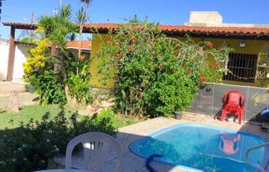 Imagem: A casa possui 2 Dormitórios, 3 Banheiros, 4 Vagas na garagem