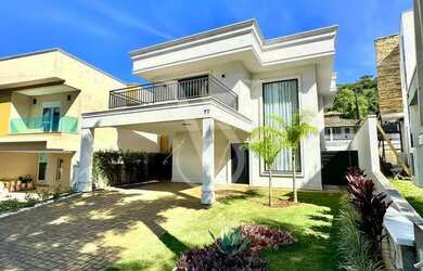 Imagem: A casa possui 3 Dormitórios, 4 Banheiros, 4 Vagas na garagem