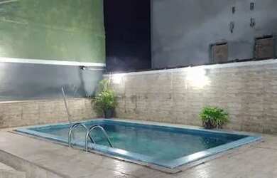 Imagem: A casa possui 2 Dormitórios, 3 Vagas na garagem e Imóvel novo