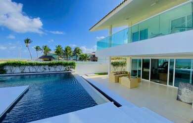 Imagem: A casa possui 5 Dormitórios, Acomodam 15 pessoas, 5 Vagas na