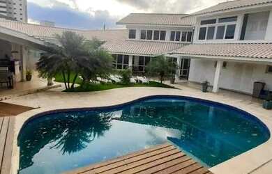 Imagem: A casa em condomínio possui 4 Dormitórios, 5 Banheiros, 5