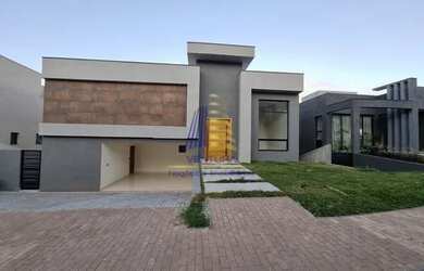 Imagem: A casa possui 3 Dormitórios, 4 Banheiros, 5 Vagas na garagem