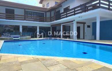 Imagem: A casa possui 4 Dormitórios, 4 Banheiros, 2 Vagas na garagem