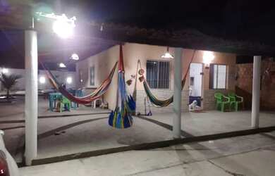 Imagem: A casa possui 3 Dormitórios, 3 Vagas na garagem e está localizado