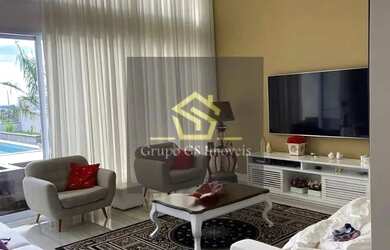 Imagem: A casa possui 4 Dormitórios, 5 Banheiros, 4 Vagas na garagem