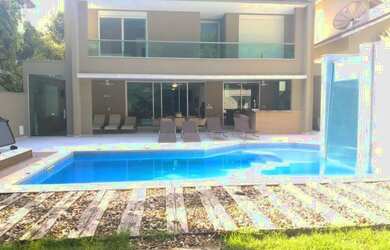 Imagem: A casa possui 5 Dormitórios, 5 Banheiros, 5 Vagas na garagem