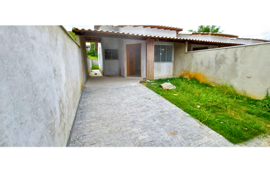 Imagem: A casa possui 2 Dormitórios, 1 Suíte, 2 Banheiros, 2 Vagas