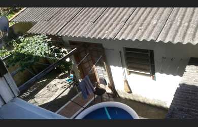 Imagem: A casa possui 5 Dormitórios, 1 Suíte, 4 Banheiros, 2 Vagas