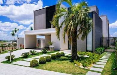 Imagem: A casa possui 5 Dormitórios, 4 Suítes, 4 Vagas na garagem