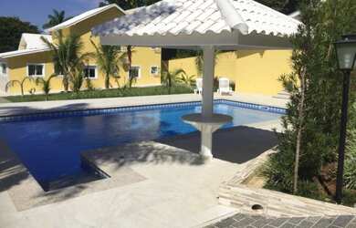 Imagem: A casa em condomínio possui 4 Dormitórios, 4 Suítes, 4 Vagas