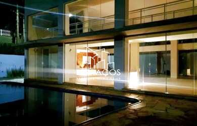 Imagem: A casa em condomínio possui 5 Dormitórios, 5 Suítes, 6 Banheiros