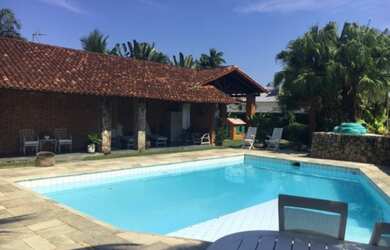 Imagem: A casa em condomínio possui 5 Dormitórios, 5 Suítes, 7 Banheiros