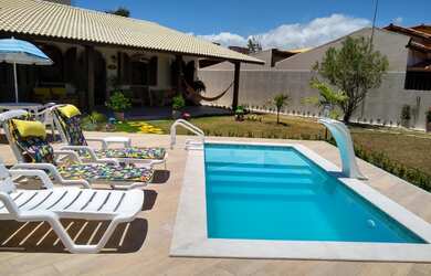 Imagem: A casa possui 5 Dormitórios, 3 Suítes, 5 Banheiros, 8 Vagas