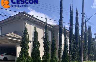 Imagem: A casa em condomínio possui 5 Dormitórios, 5 Suítes, 8 Banheiros