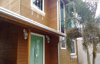 Imagem: A casa possui 2 Dormitórios, 2 Banheiros, 3 Vagas na garagem