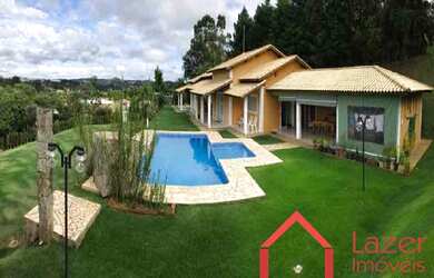 Imagem: A chácara possui 4 Dormitórios, 2 Suítes, 3 Banheiros e 3