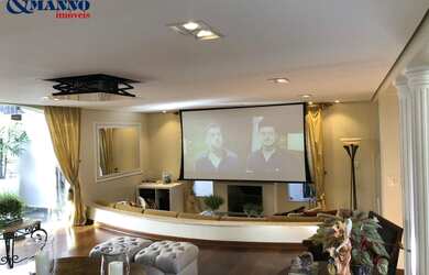 Imagem: A casa possui 3 Dormitórios, 3 Suítes, 5 Banheiros, 4 Vagas