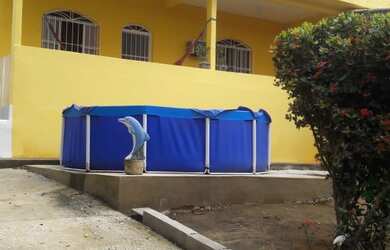 Imagem: A casa possui 3 Dormitórios, 1 Suíte, 1 Banheiro, 3 Vagas