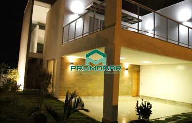 Imagem: A casa possui 4 Dormitórios, 4 Suítes, 7 Banheiros, 6 Vagas