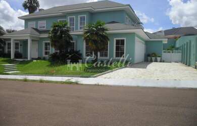 Imagem: A casa possui 5 Dormitórios, 5 Suítes, 6 Banheiros, 7 Vagas