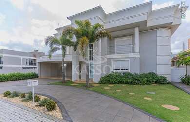 Imagem: A casa em condomínio possui 4 Dormitórios, 4 Suítes, 6 Banheiros