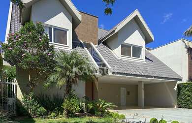 Imagem: A casa em condomínio possui 1 Dormitório, 4 Suítes, 5 Banheiros