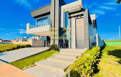 Imagem: A casa em condomínio possui 5 Dormitórios, 5 Suítes, 6 Banheiros