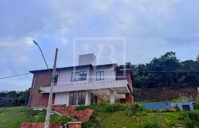 Imagem: A casa em condomínio possui 4 Dormitórios, 4 Suítes, 5 Banheiros