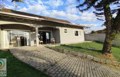 Imagem: A casa possui 3 Dormitórios, 3 Banheiros, 3 Vagas na garagem