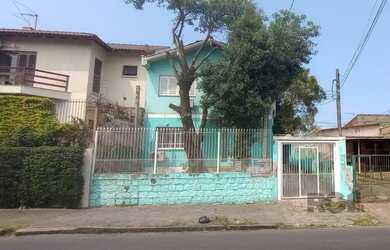 Imagem: A casa possui 4 Dormitórios, 1 Suíte, 5 Banheiros, 4 Vagas