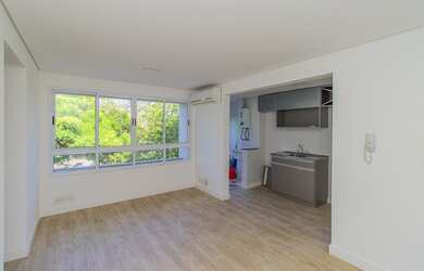 Imagem: O apartamento possui 1 Dormitório, 1 Banheiro, 1 Vaga na garagem