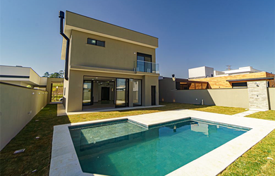 Imagem: A casa possui 3 Dormitórios, 3 Suítes, 5 Banheiros, 4 Vagas