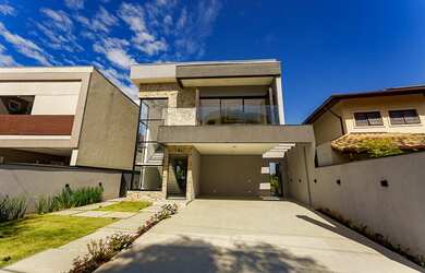 Imagem: A casa possui 5 Dormitórios, 5 Suítes, 6 Banheiros, 4 Vagas