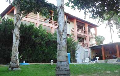 Imagem: A casa possui 4 Dormitórios, 4 Suítes, 1 Banheiro, 4 Vagas