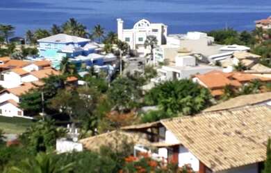 Imagem: A casa e possui 6 Dormitórios, 5 Suítes, 2 Banheiros, 2 Vagas