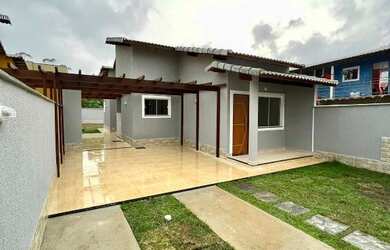 Imagem: A casa possui 2 Dormitórios, 1 Suíte, 1 Banheiro, 2 Vagas