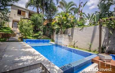 Imagem: A casa possui 3 Dormitórios, 3 Suítes, 7 Banheiros, 4 Vagas