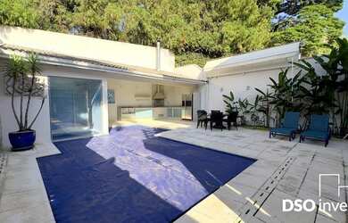 Imagem: A casa em condomínio possui 5 Dormitórios, 5 Suítes, 6 Banheiros